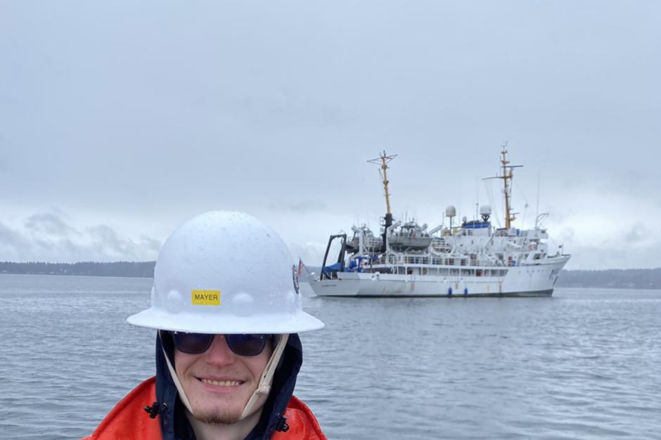 Garret Mayer with NOAA Ship Fairweather in the background.